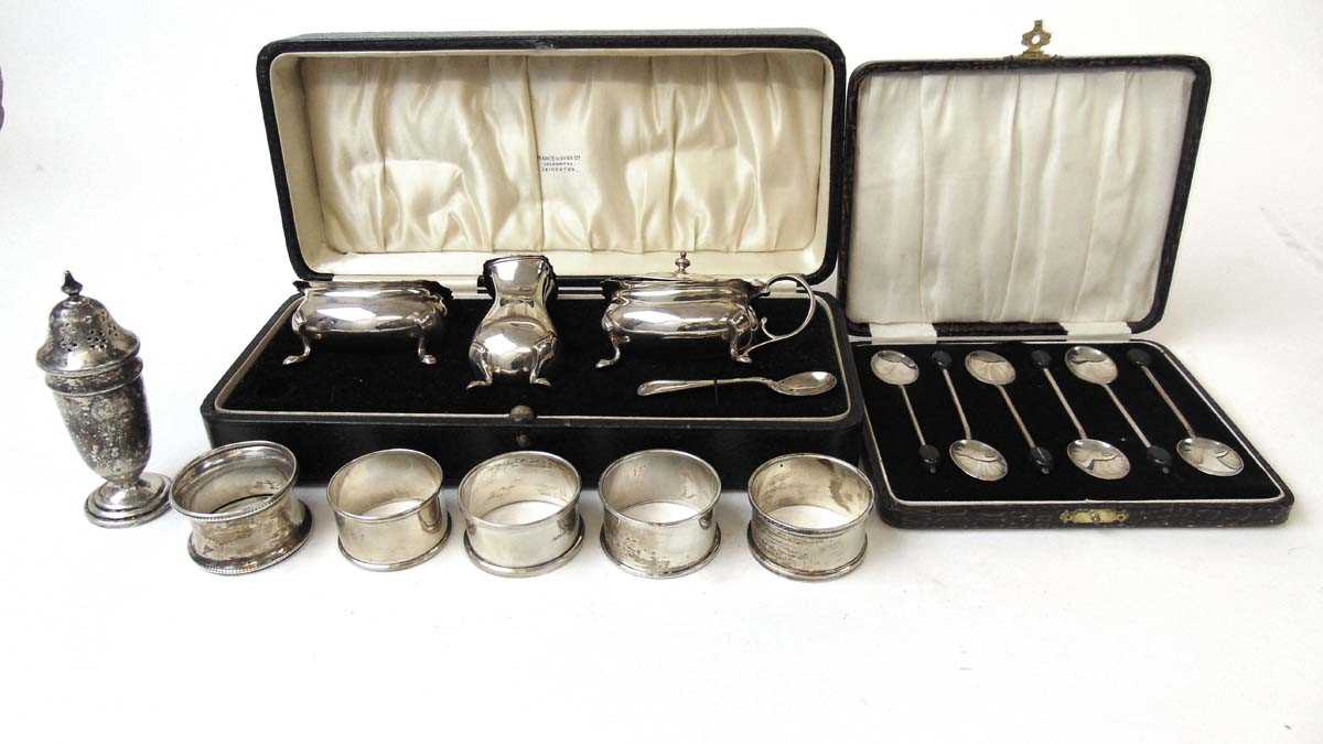 A silver cruet set, Edward Barnard & Sons Ltd, London 1931; a set of six sterling silver coffee bean