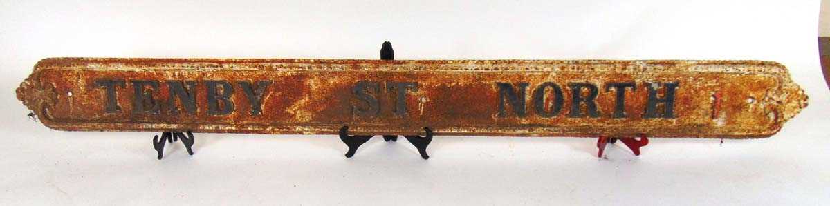 A Victorian cast iron street sign for ' Tenby St North', with cast foliate terminals beaded