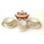 Two Derby porcelain tea bowls and saucers, late 18th century, one with spiral moulded fluting with