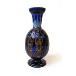 A Doulton Lambeth vase by Florence Barlow, incised with daggers and foliate scrolls against a blue