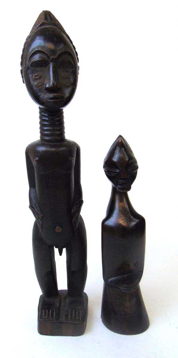 A Baule standing figure of a man, Ivory Coast, with carved coiffure, scarifications to his cheeks