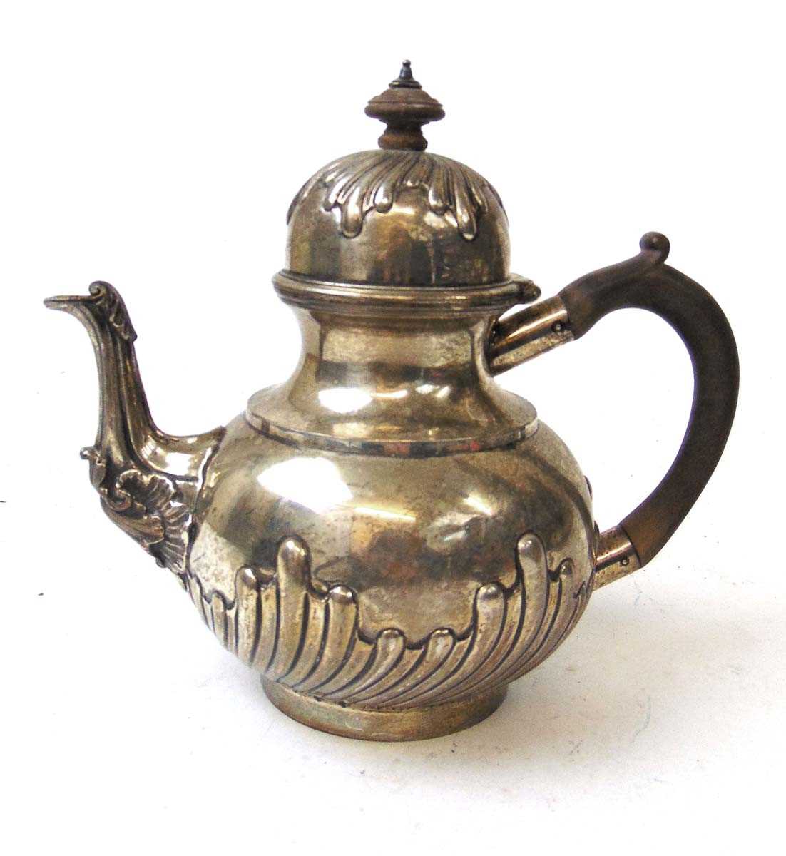 A Victorian silver tea pot, Charles Stuart Harris, London 1883, the spout with foliate scroll cap