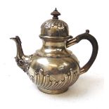 A Victorian silver tea pot, Charles Stuart Harris, London 1883, the spout with foliate scroll cap