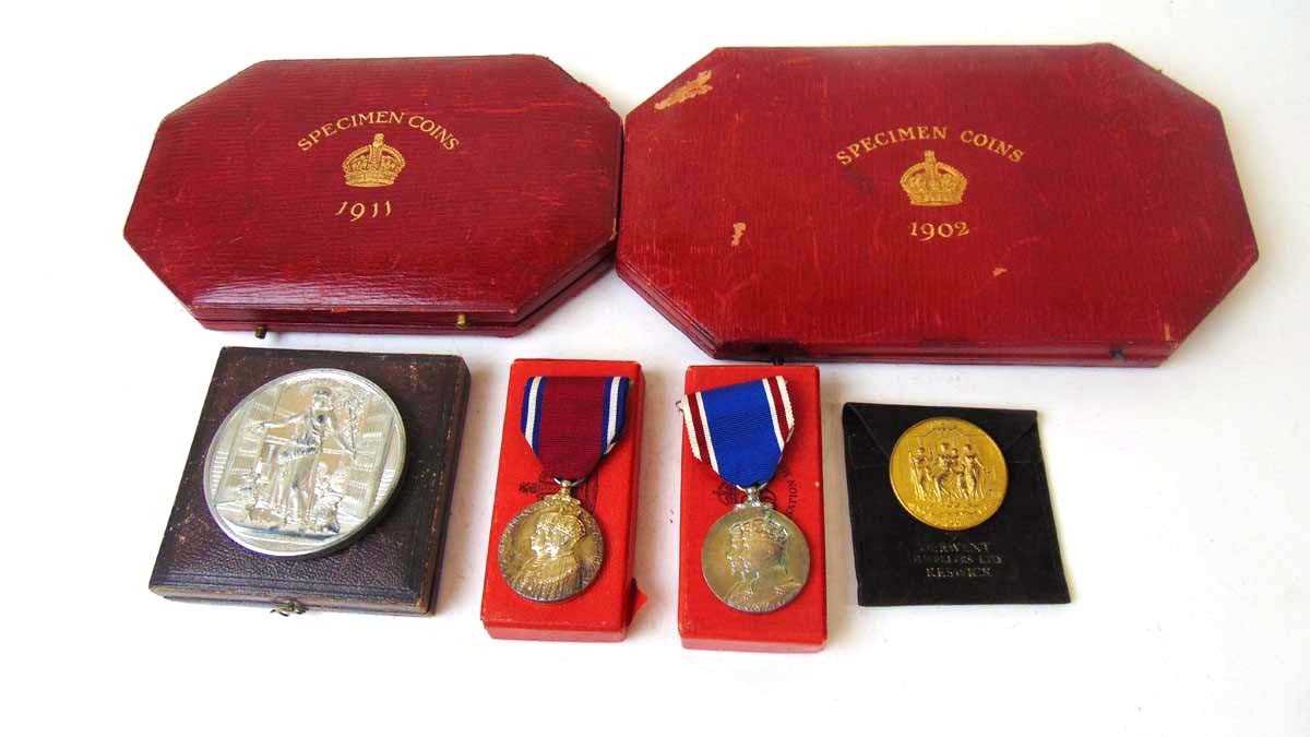 Vacant Specimen Coin cases for 1902 & 1911, a white metal medal commemorating the opening of Crystal