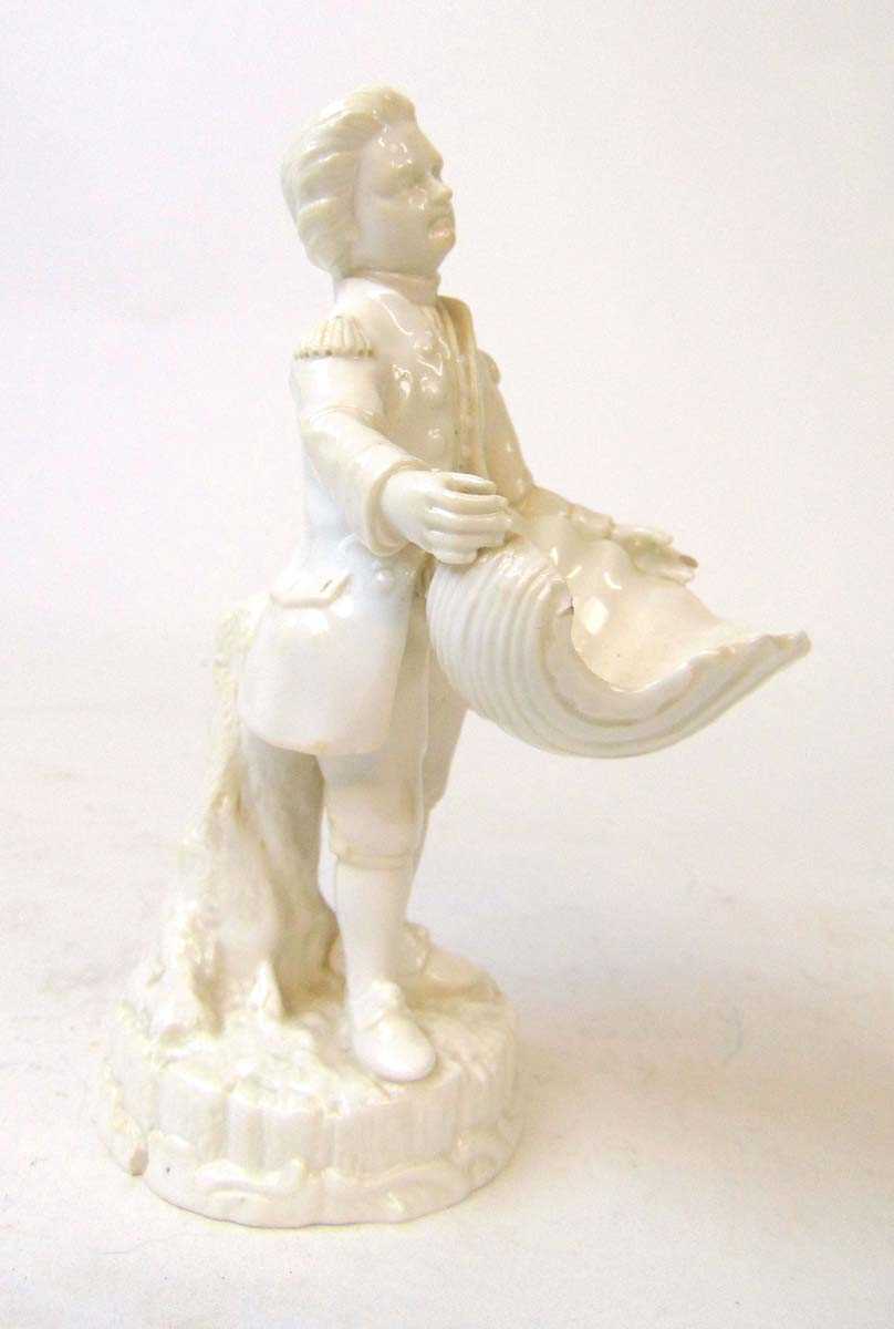 A 19th century Derby (Stevenson & Hancock) porcelain figural salt, modelled as a gent holding a