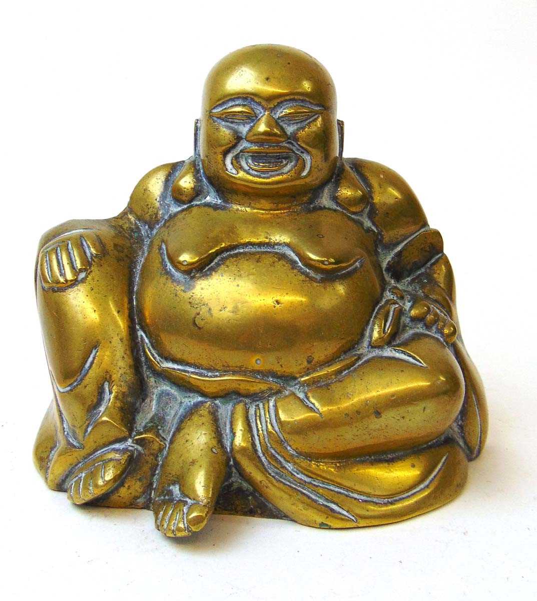 A cast brass figure of Hotei, the laughing buddha, cast with a smiling face and large exposed