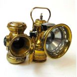 A Miller & Co Ltd 'Excelite' and 'Monarch' carbide bicycle lights, the Excelite with red and green