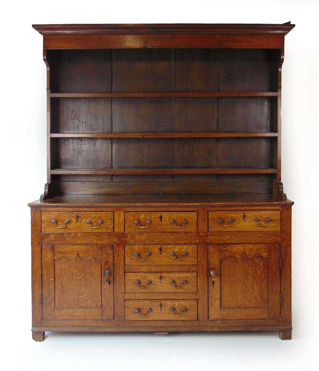 A George III oak Welsh dresser, with cavetto moulded pediment above the boarded back with three - Image 3 of 39