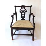 A 19th century mahogany Chippendale style armchair, with carve top rail above a pierced back ,