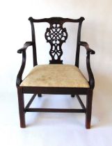 A 19th century mahogany Chippendale style armchair, with carve top rail above a pierced back ,