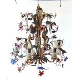 A venetian style six branch electric chandelier, decorated with scrolling metal fronds with leaves