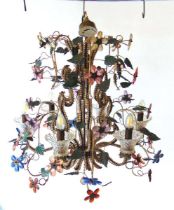 A venetian style six branch electric chandelier, decorated with scrolling metal fronds with leaves