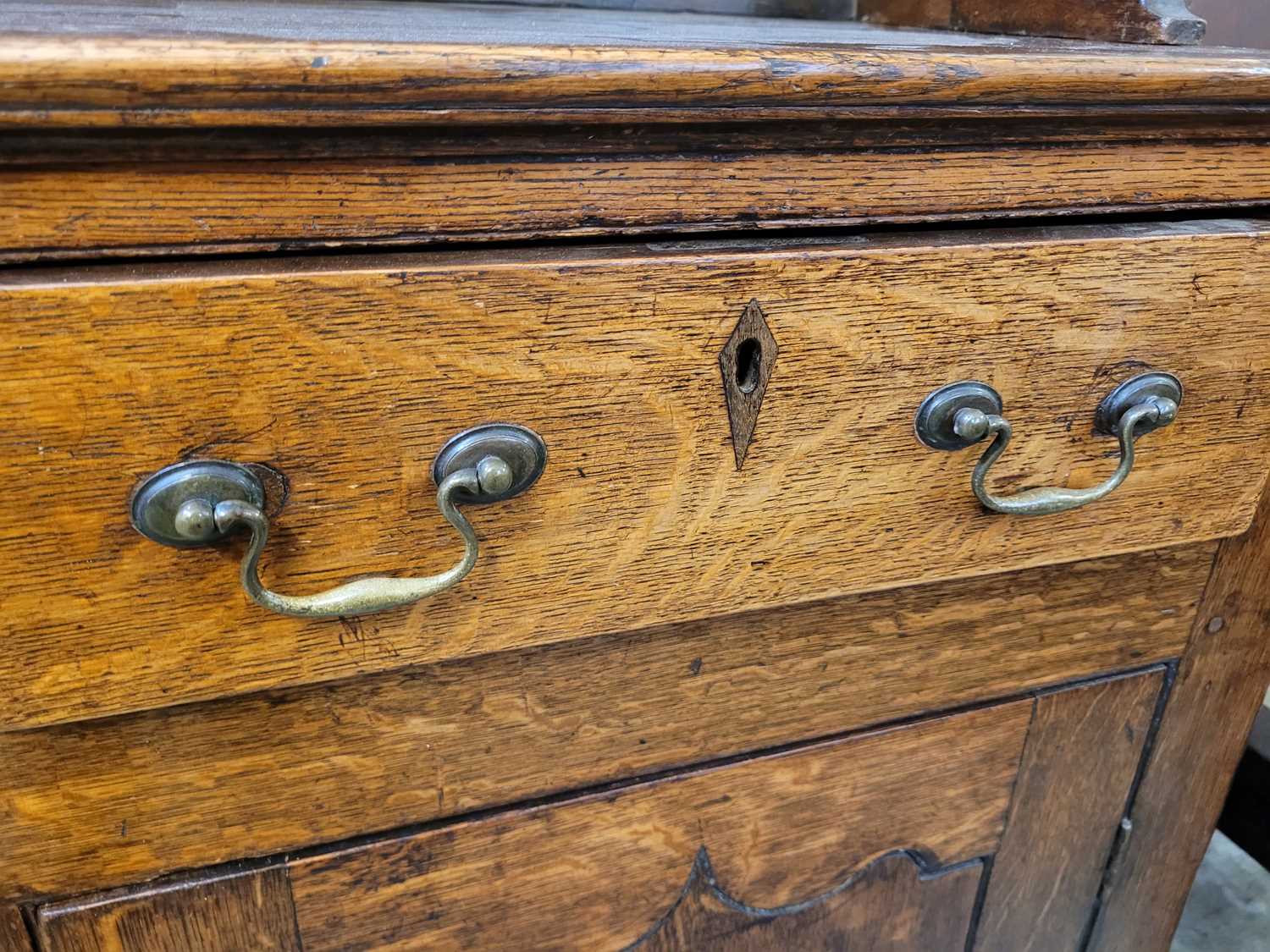 A George III oak Welsh dresser, with cavetto moulded pediment above the boarded back with three - Image 27 of 39