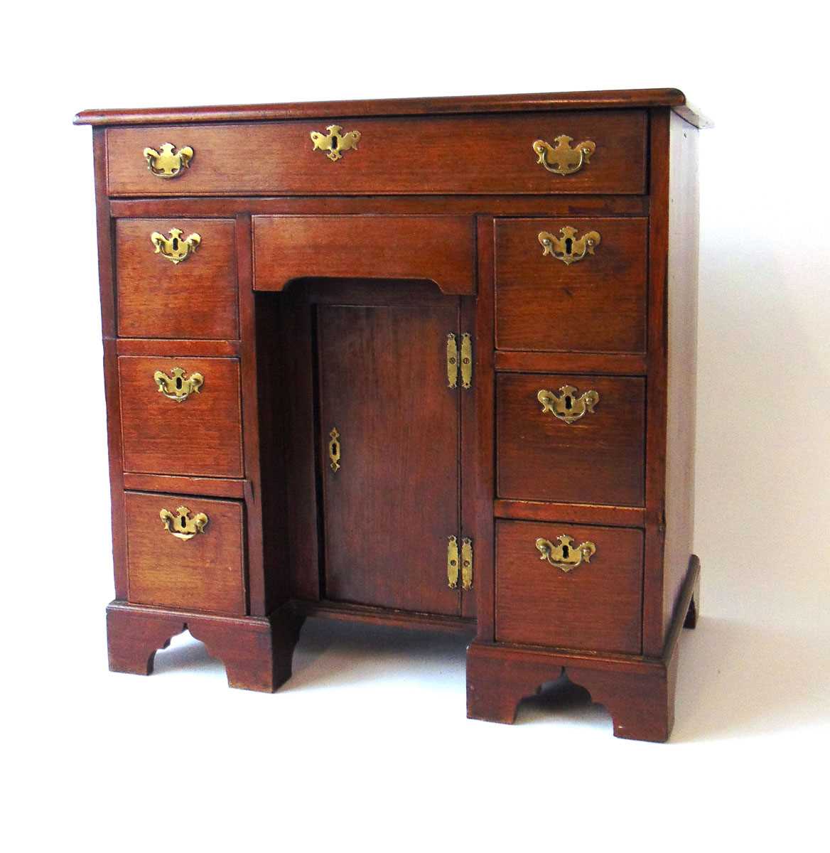 An 18th century mahogany kneehole desk, with applied moulded edge, over an arrangement of one long - Image 3 of 4