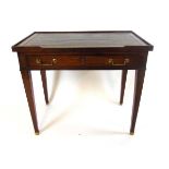 An early 19th century mahogany writing table, with blind gallery and tooled leather writing surface,