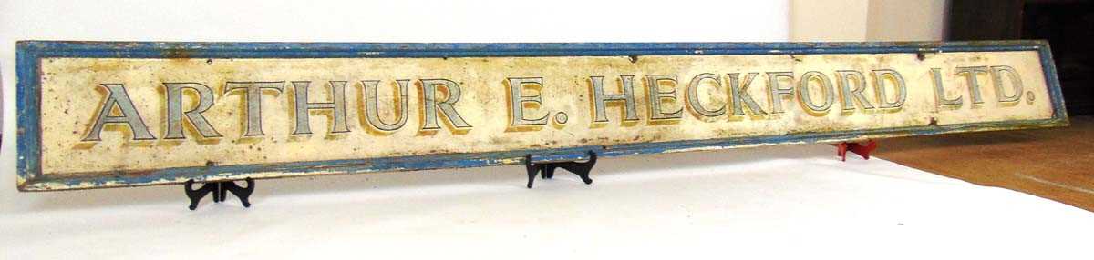 A large painted wood shop sign advertising 'Arthur E Heckford Ltd', 350cm x 35.5cm Graces Guide