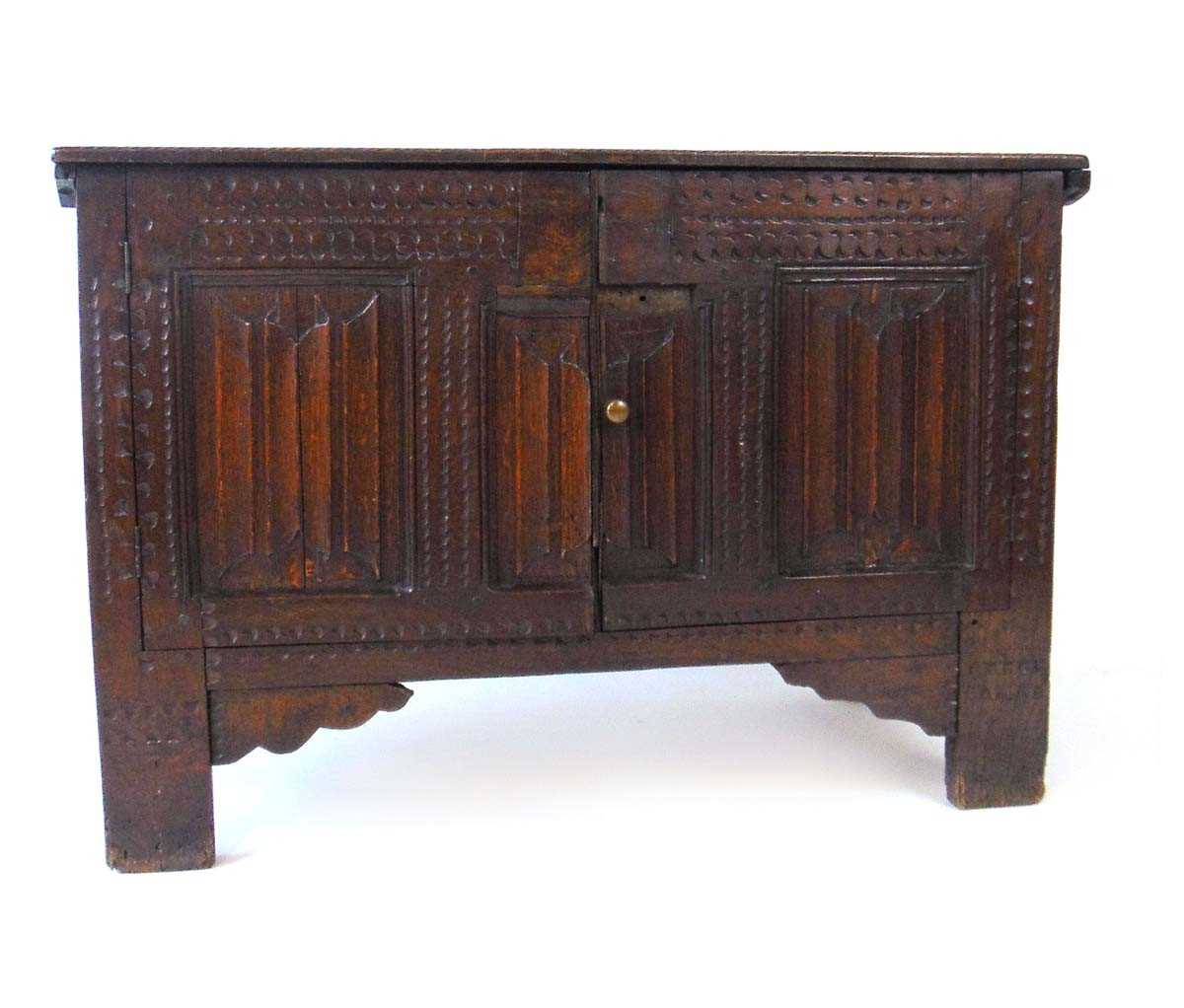 An early 18th century oak blanket box, later converted to a cupboard, with carved linen fold panels, - Image 2 of 4