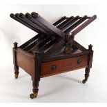 A William IV rosewood four division canterbury, with single drawer, on turned legs with brass