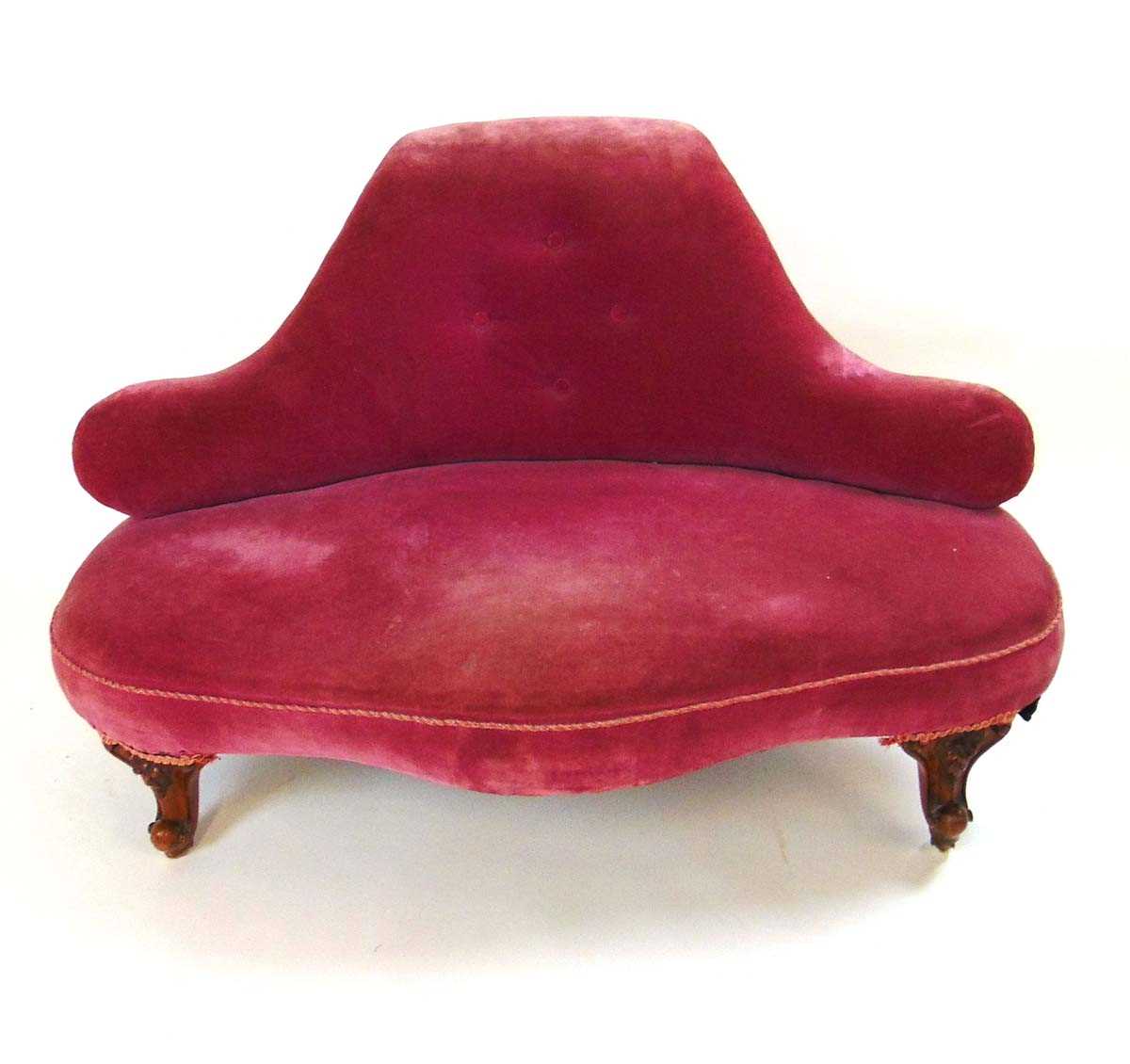 A Victorian conversation settee, the scrolling back and serpentine front seat with horsehair