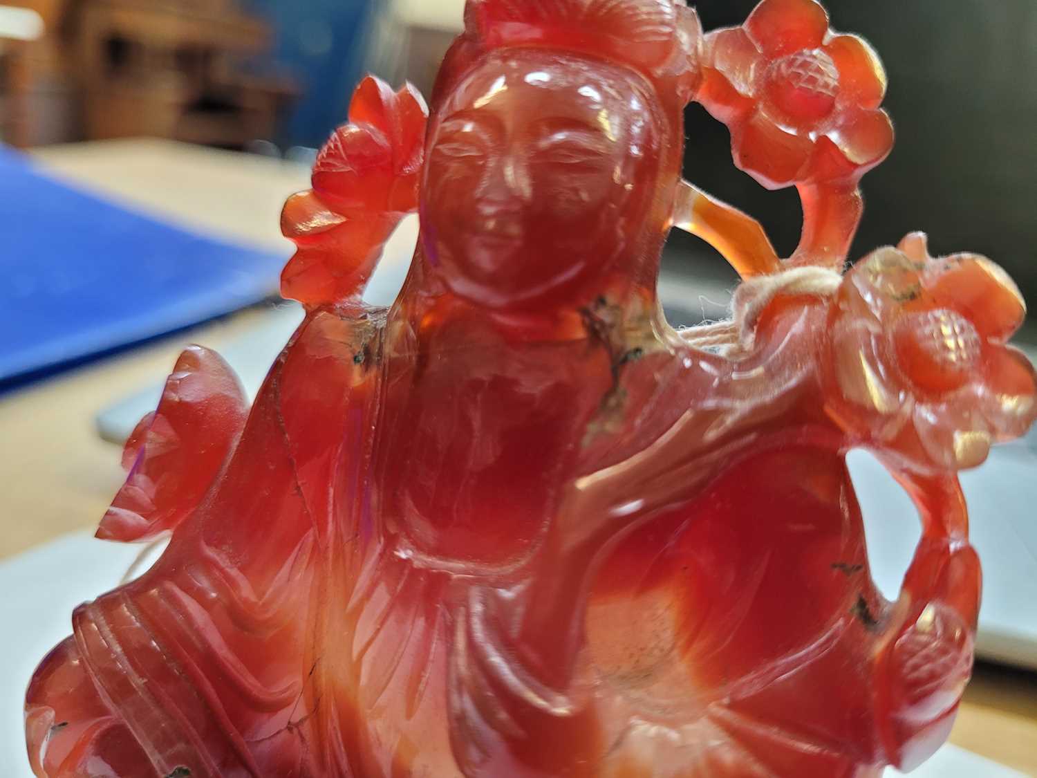 A Chinese carnelain figure of Guan Yin, 20th century, in seated pose holding a branch of - Image 9 of 13