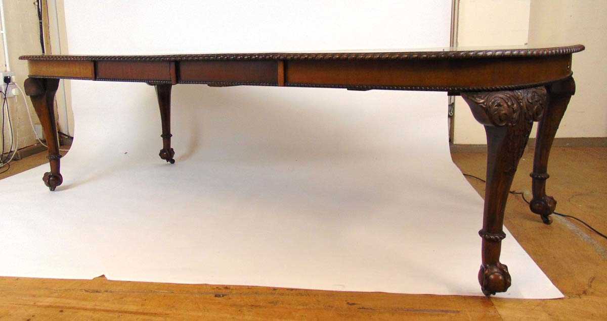 A mahogany extending dining table, early 20th century, with carved gadrooned edge, supported on four - Image 2 of 11