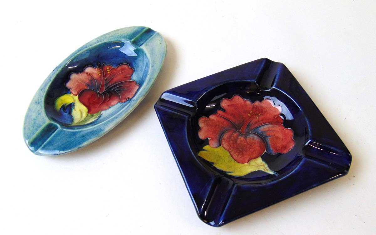 Two William Moorcroft Hibiscus pattern ashtrays, early to mid 20th century, each with applied