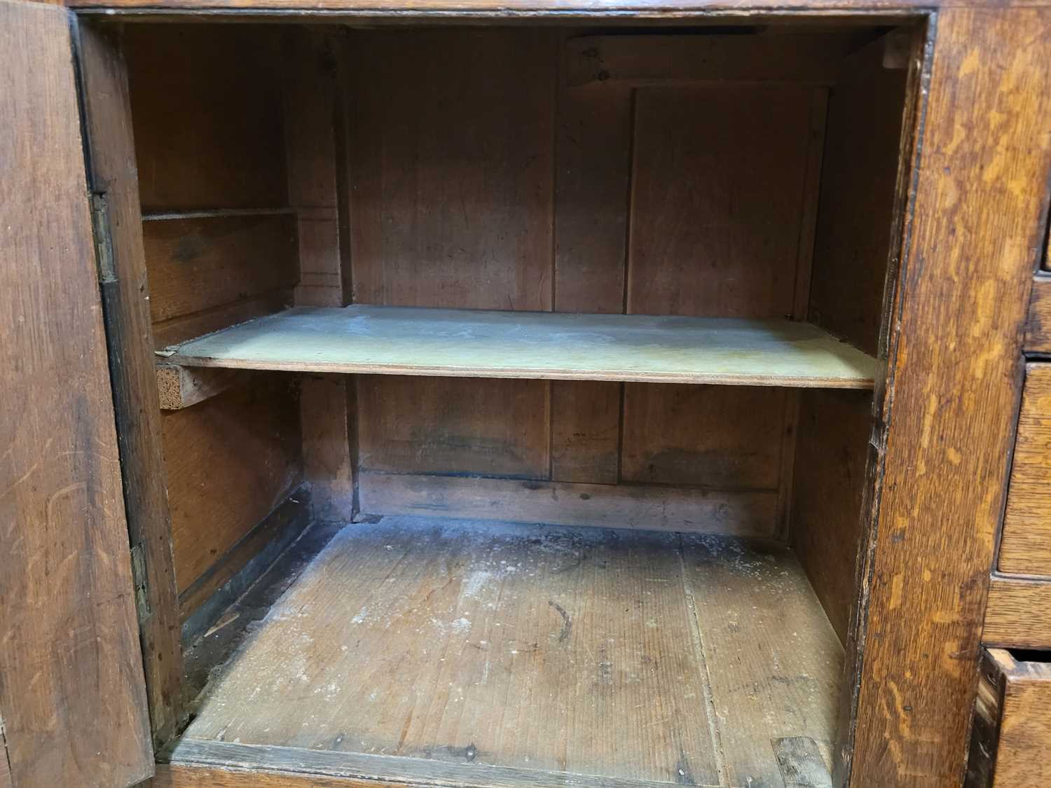 A George III oak Welsh dresser, with cavetto moulded pediment above the boarded back with three - Image 35 of 39