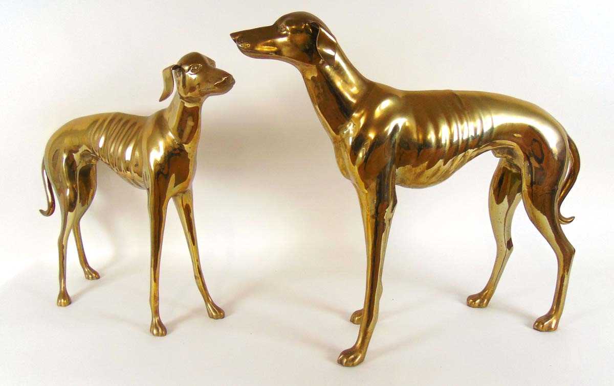 Two hollow cast figures of standing greyhounds, 66cm & 74cm high