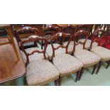 A set of eight Victorian mahogany dining chairs, with shaped top rail and stuff over horsehair