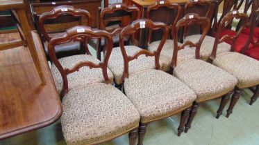 A set of eight Victorian mahogany dining chairs, with shaped top rail and stuff over horsehair