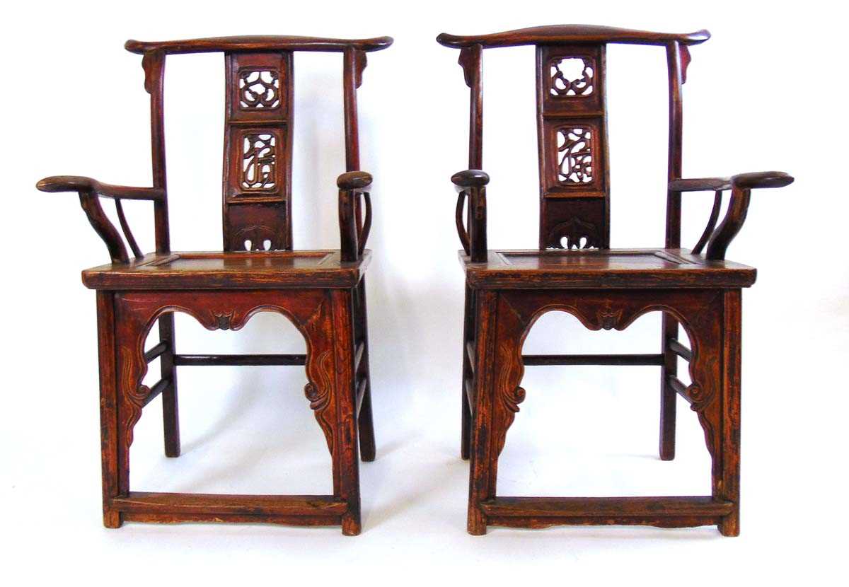 A pair of Chinese elm official hat armchairs, Qing dynasty, the shaped top rail above a pierced ruyi - Image 4 of 4