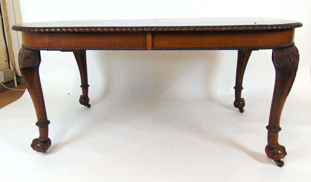 A mahogany extending dining table, early 20th century, with carved gadrooned edge, supported on four - Image 4 of 11