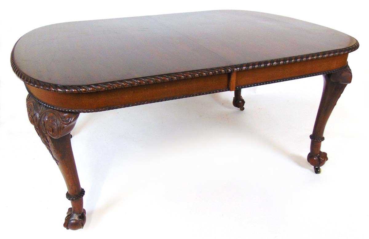 A mahogany extending dining table, early 20th century, with carved gadrooned edge, supported on four - Image 5 of 11