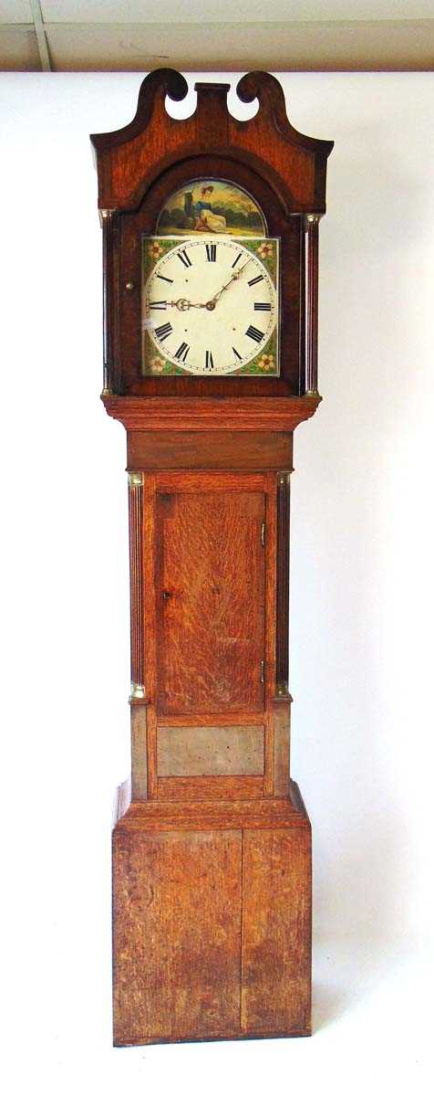 A late 18th century 30 hour oak and mahogany longcase clock, with swans neck pediment above the