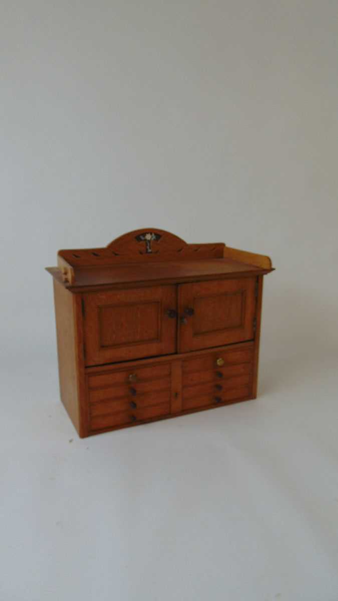 An early 20th century table top oak cabinet, with blind gallery above two cupboard doors and eight - Image 2 of 3