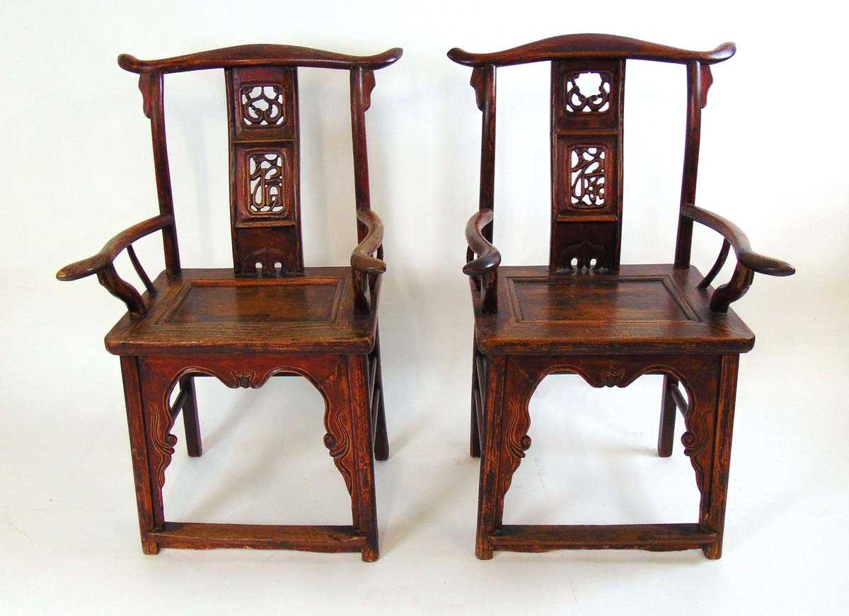 A pair of Chinese elm official hat armchairs, Qing dynasty, the shaped top rail above a pierced ruyi - Image 3 of 4
