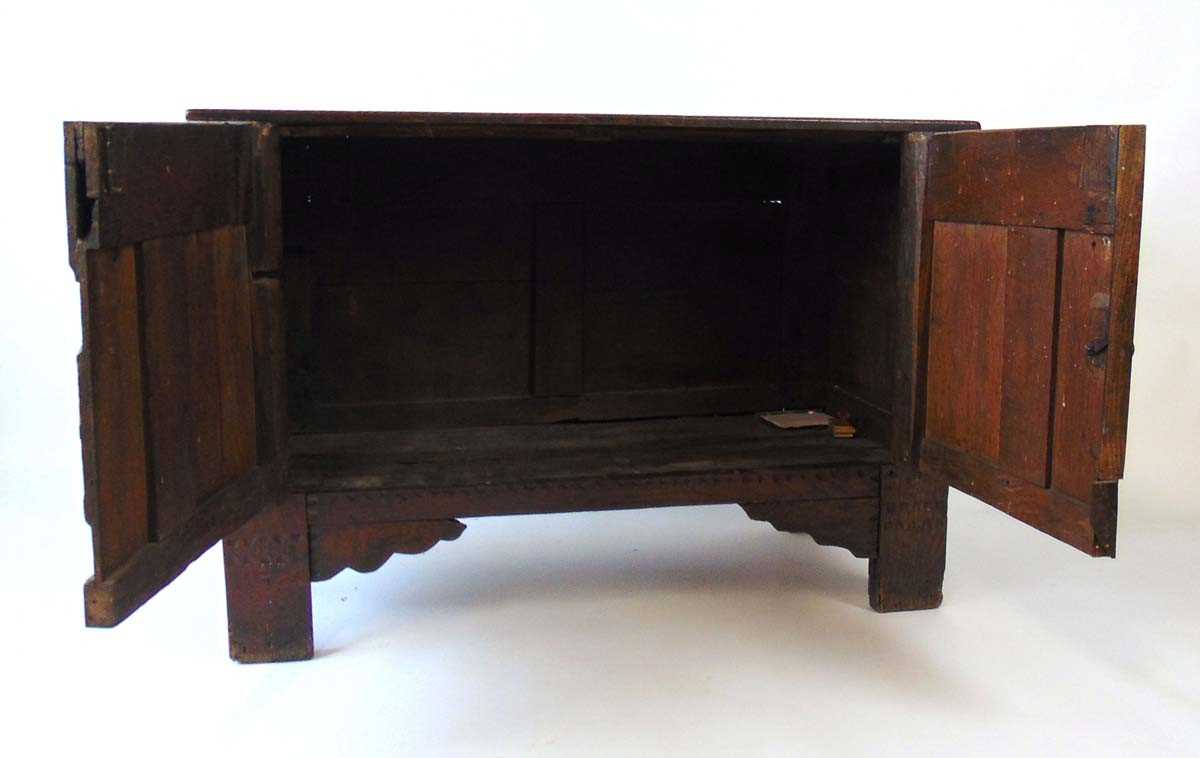 An early 18th century oak blanket box, later converted to a cupboard, with carved linen fold panels, - Image 3 of 4
