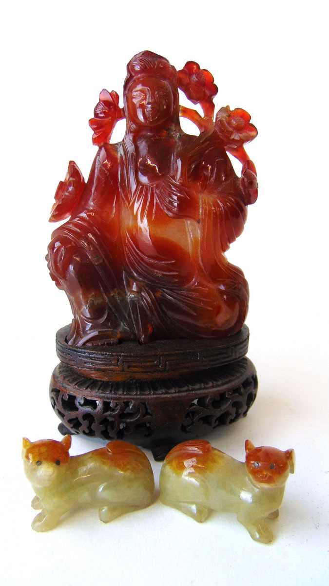 A Chinese carnelain figure of Guan Yin, 20th century, in seated pose holding a branch of - Image 2 of 13