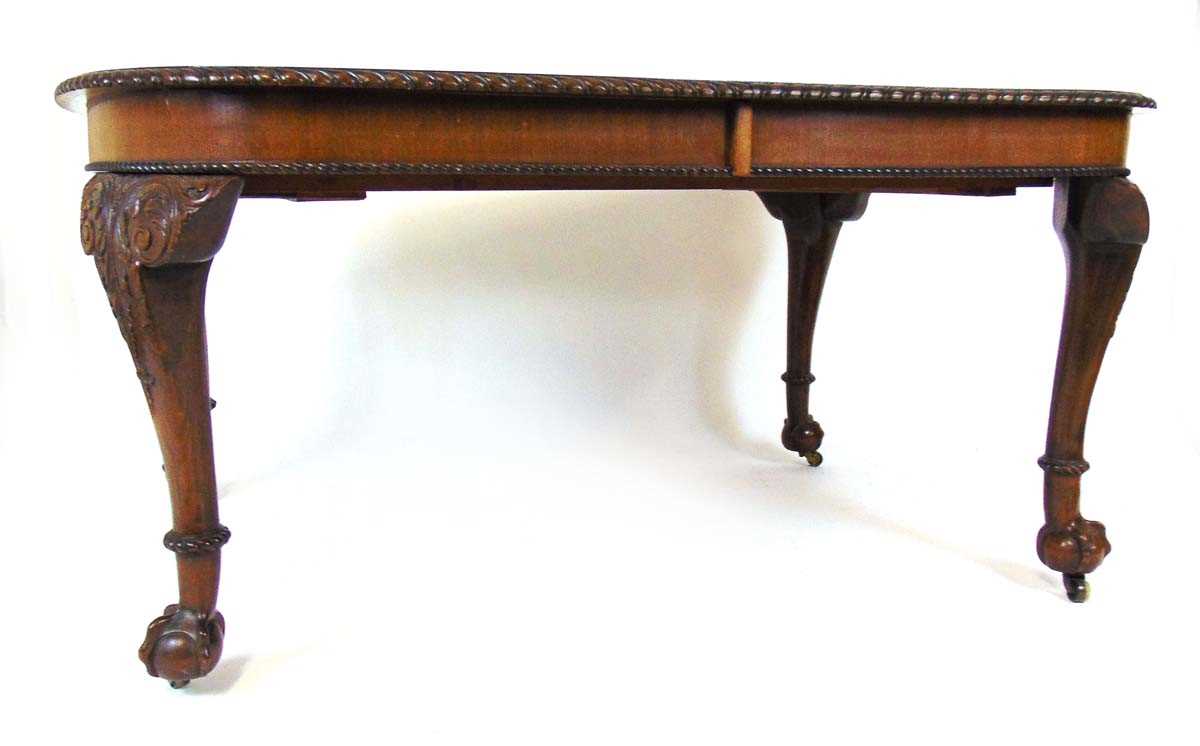A mahogany extending dining table, early 20th century, with carved gadrooned edge, supported on four - Image 6 of 11