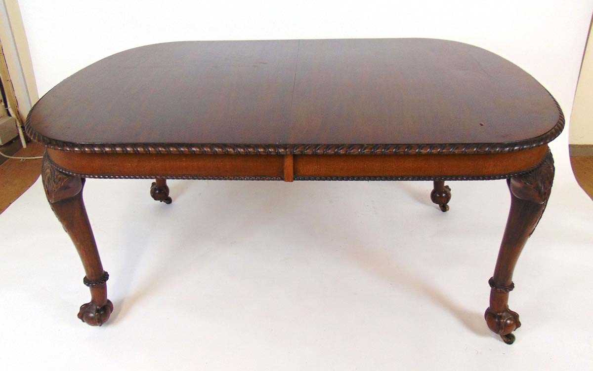 A mahogany extending dining table, early 20th century, with carved gadrooned edge, supported on four - Image 3 of 11