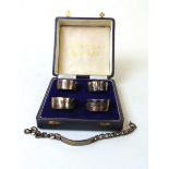 A set of four silver napkin rings, J B Chatterley & Sons, assay marks for Birmingham, Edinburgh,