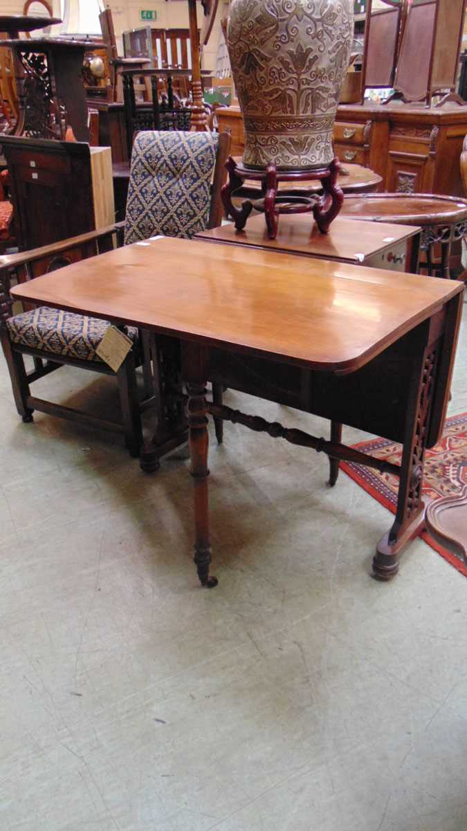 A Victorian rosewood Sutherland table, with elliptical drop leaves, on pierced foliate fretwork