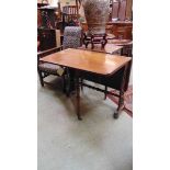 A Victorian rosewood Sutherland table, with elliptical drop leaves, on pierced foliate fretwork