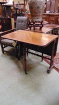 A Victorian rosewood Sutherland table, with elliptical drop leaves, on pierced foliate fretwork