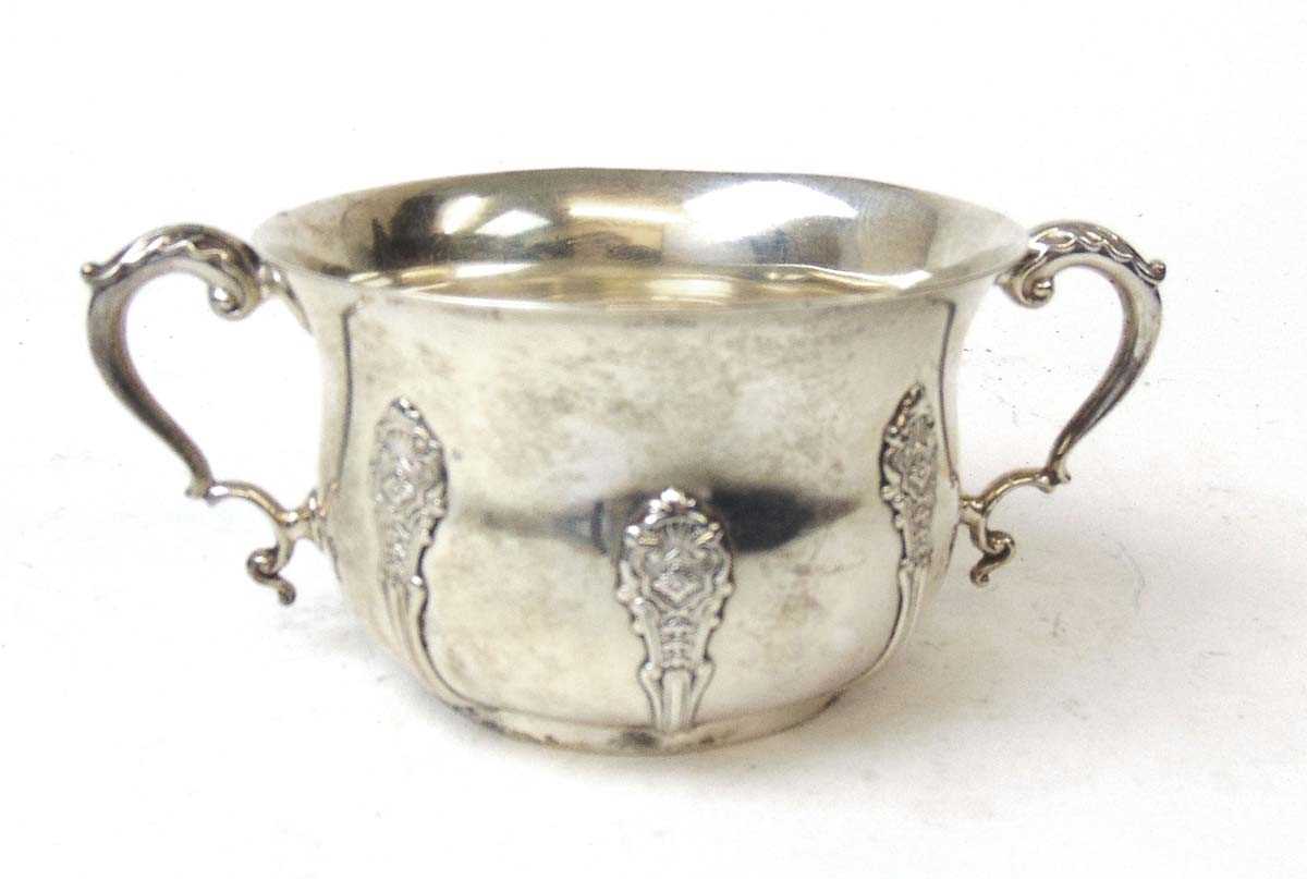 A silver two handled sugar bowl, Elkington & Co, Birmingham 1942, with foliate scroll capped handles