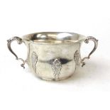 A silver two handled sugar bowl, Elkington & Co, Birmingham 1942, with foliate scroll capped handles