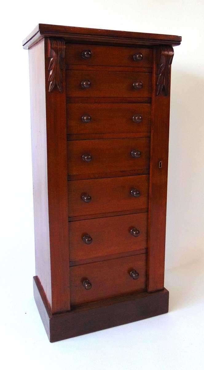 A Victorian mahogany Wellington chest, the seven drawers with turned knops, flanked by carved - Image 4 of 8