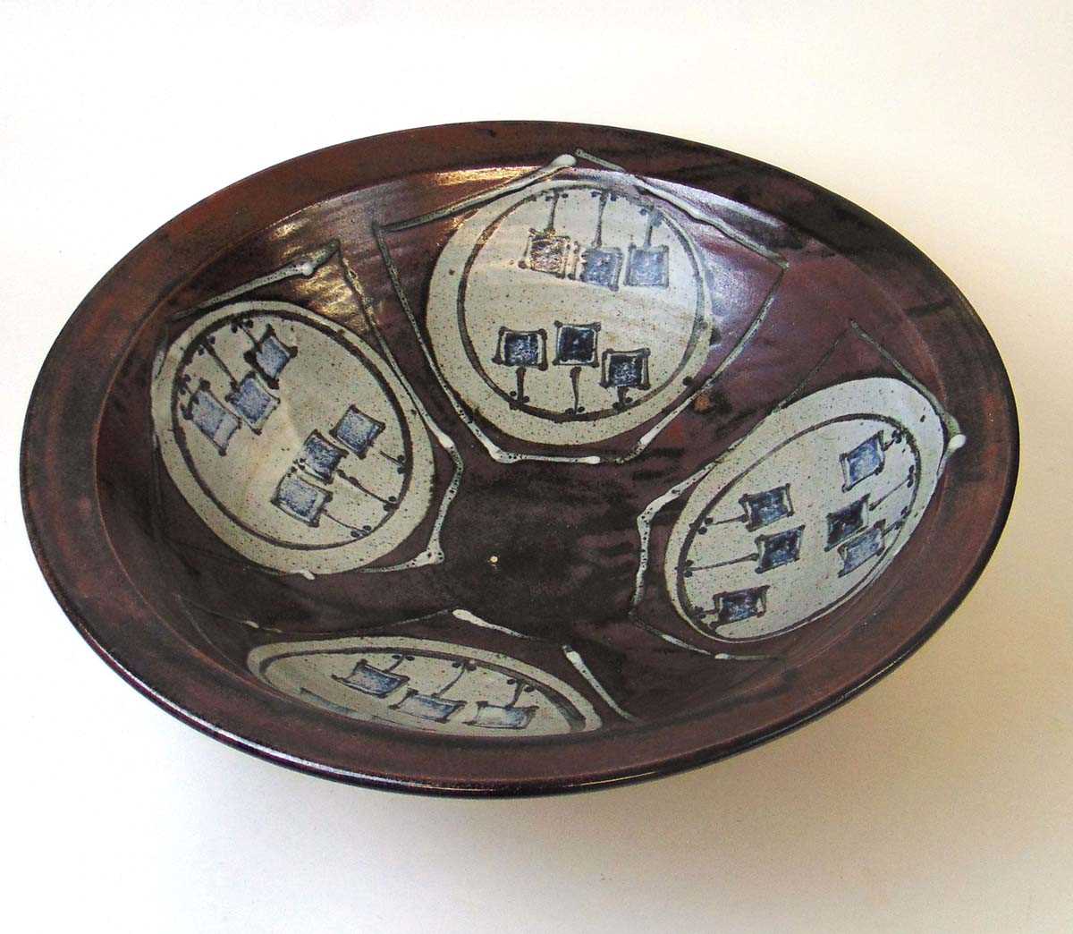 A large studio pottery bowl, the interior decorated with a four pentagons framing roundels each with - Image 2 of 3