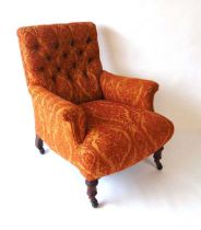 A Victorian upholstered armchair, with button back and scroll arm rests, with horsehair filling,