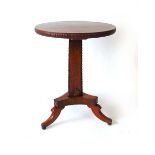 A Regency mahogany occasional table, the circular top with applied match striker edge, on a